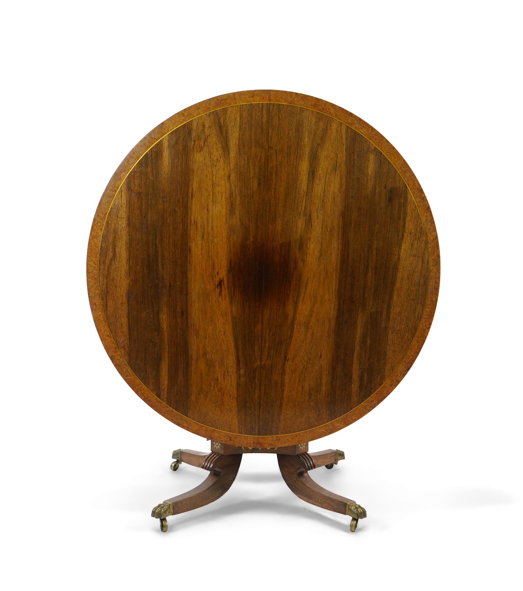 A Regency cut brass inlaid and gilt metal mounted circular rosewood breakfast table